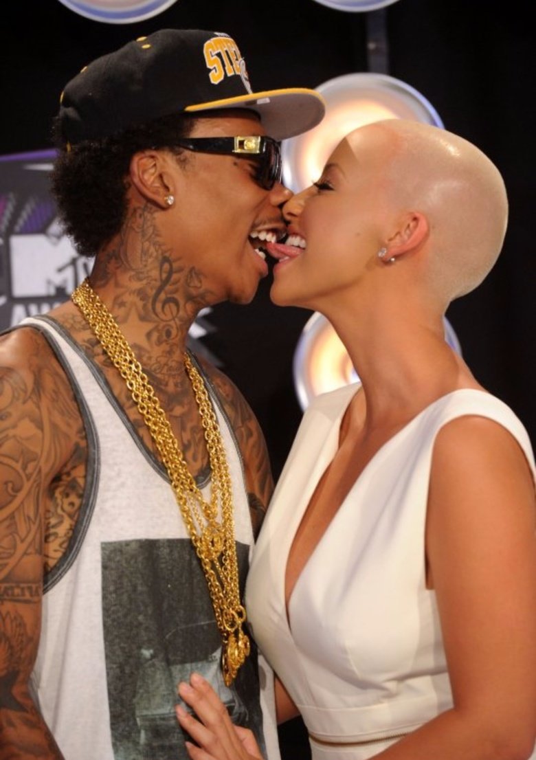 Wiz Khalifa Took Kanye's Sloppy 2nd's. This was just sick how Wiz Khalifa watched every move Kanye West made with Amber Rose and then copied it.. I assume he is licking her head for good luck